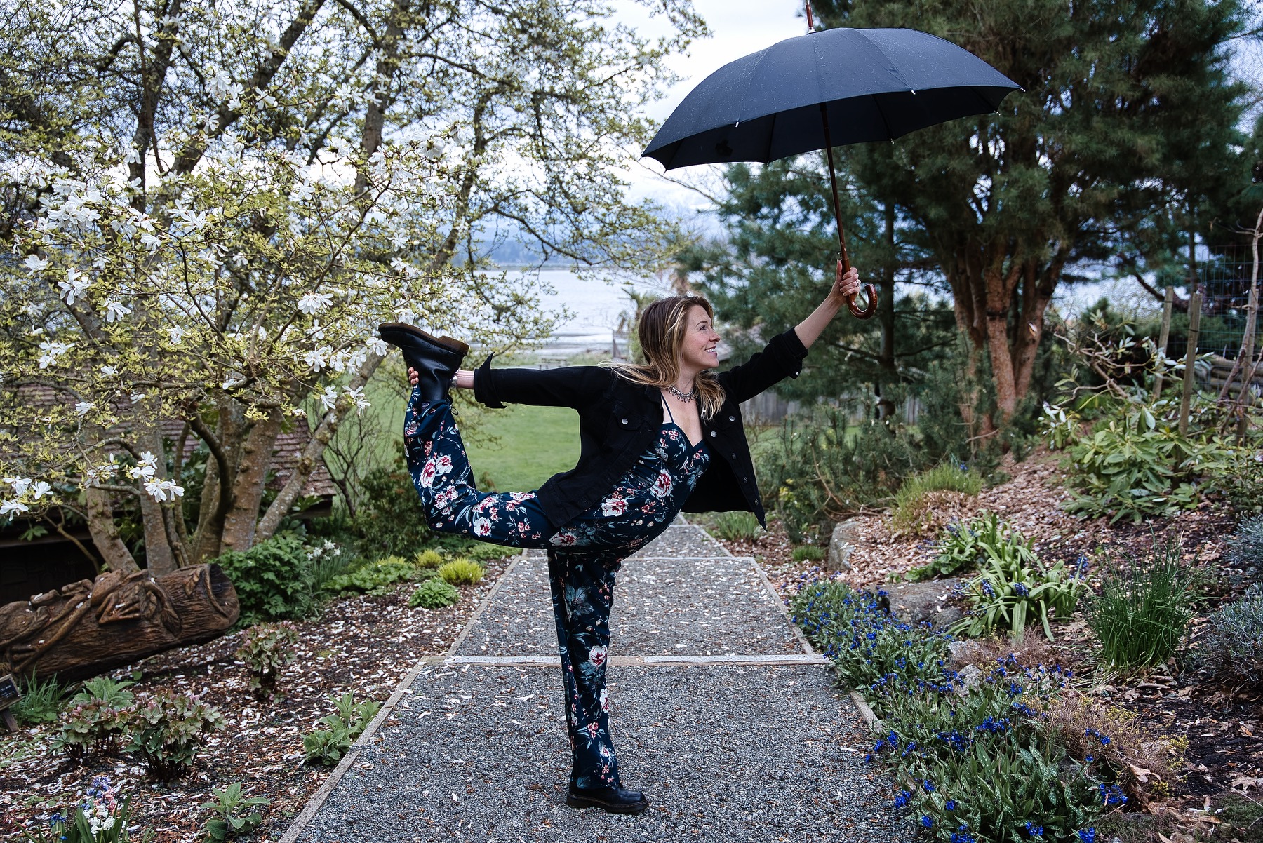 A woman basking in the spring weather with an umbrella