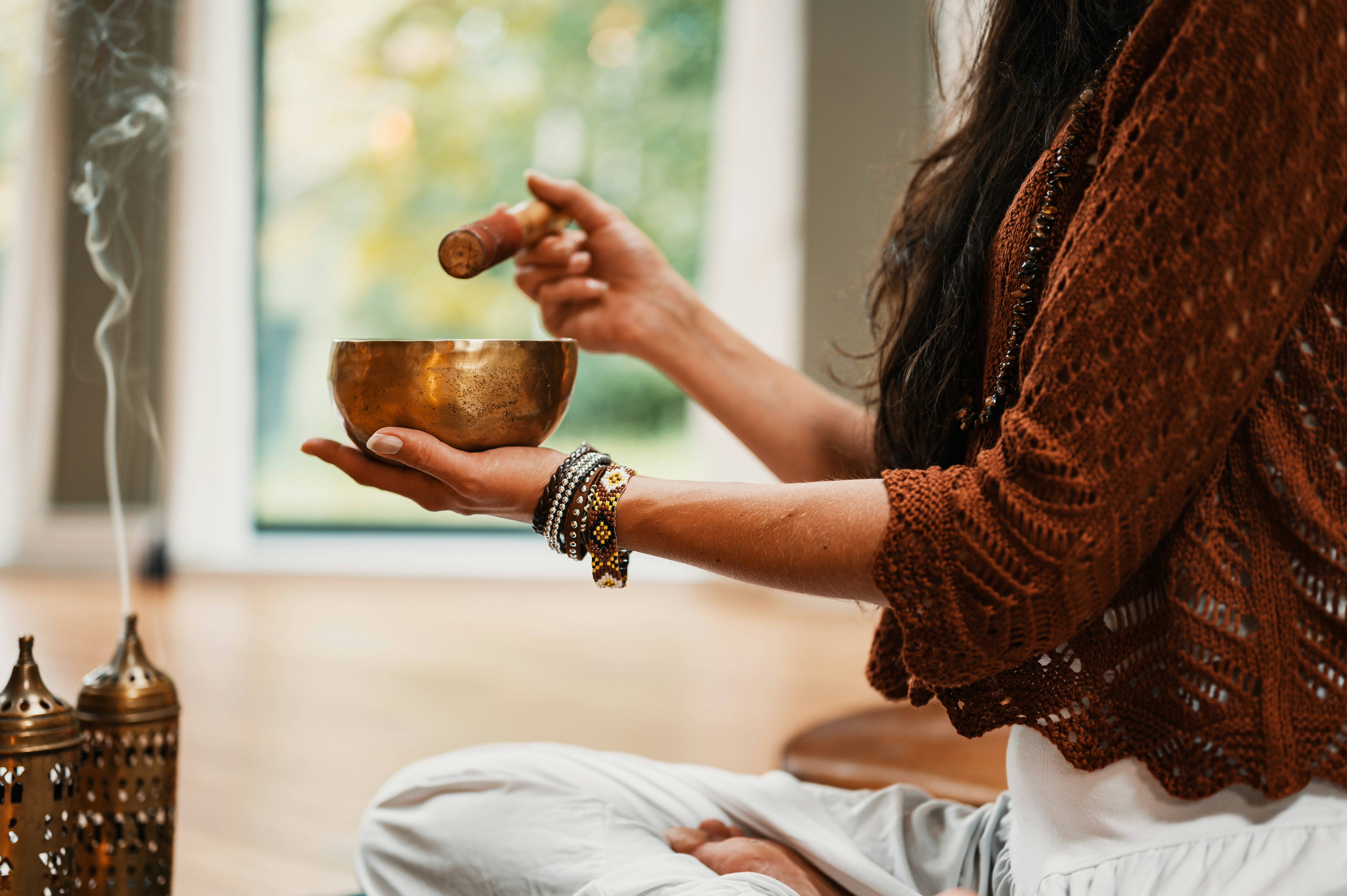 a woman holding a cup