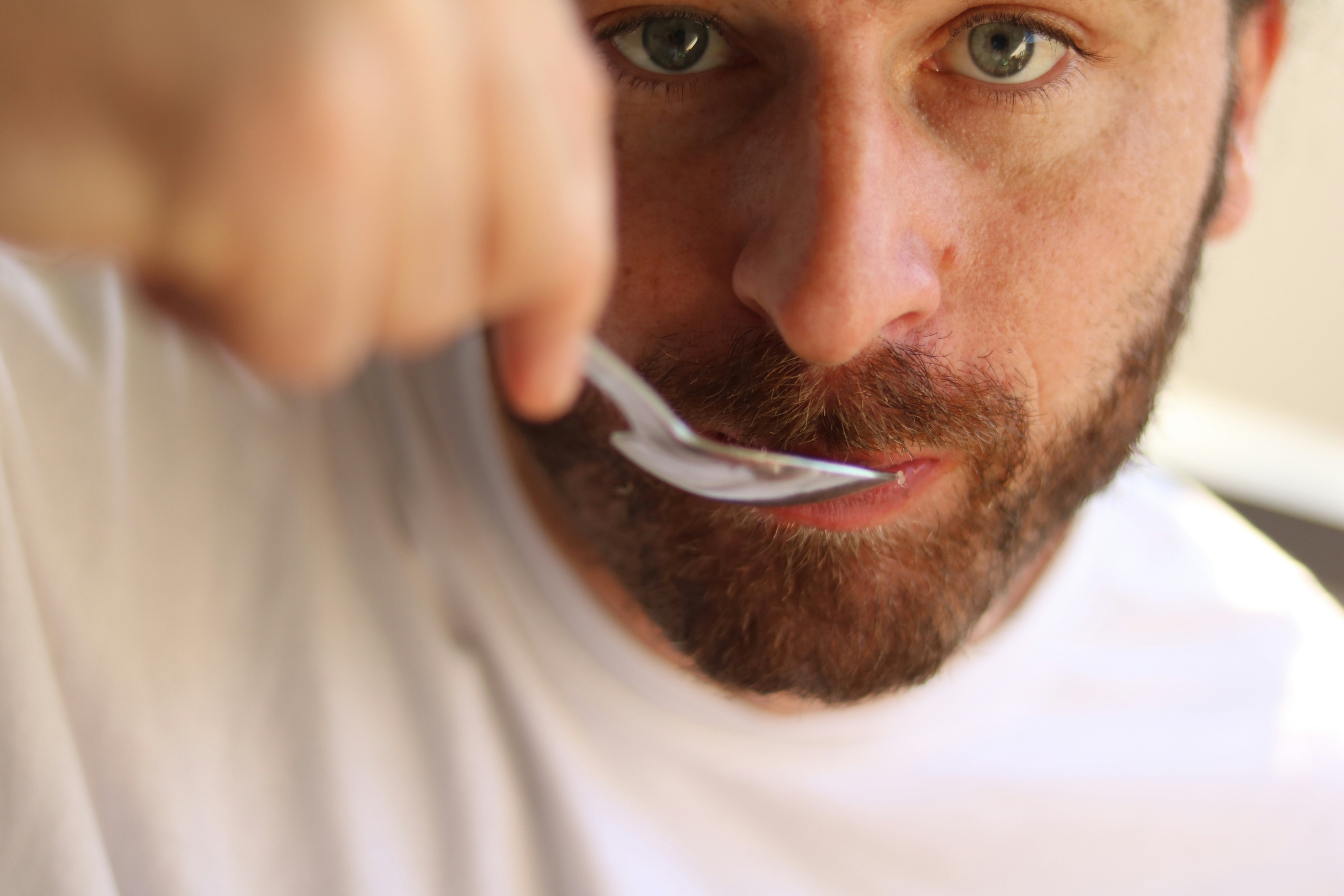 A man eating with spoon