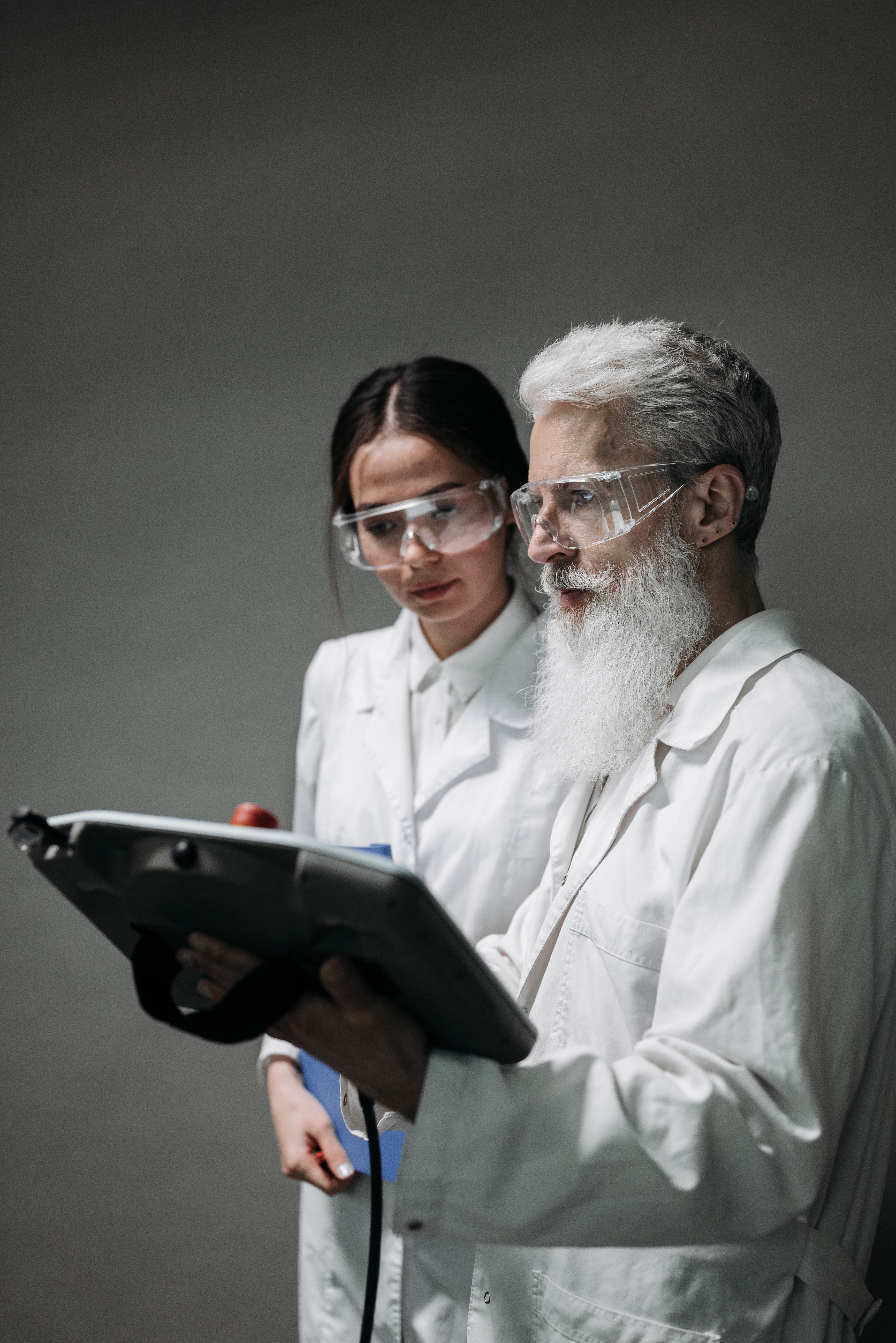 Two researchers looking at a screen