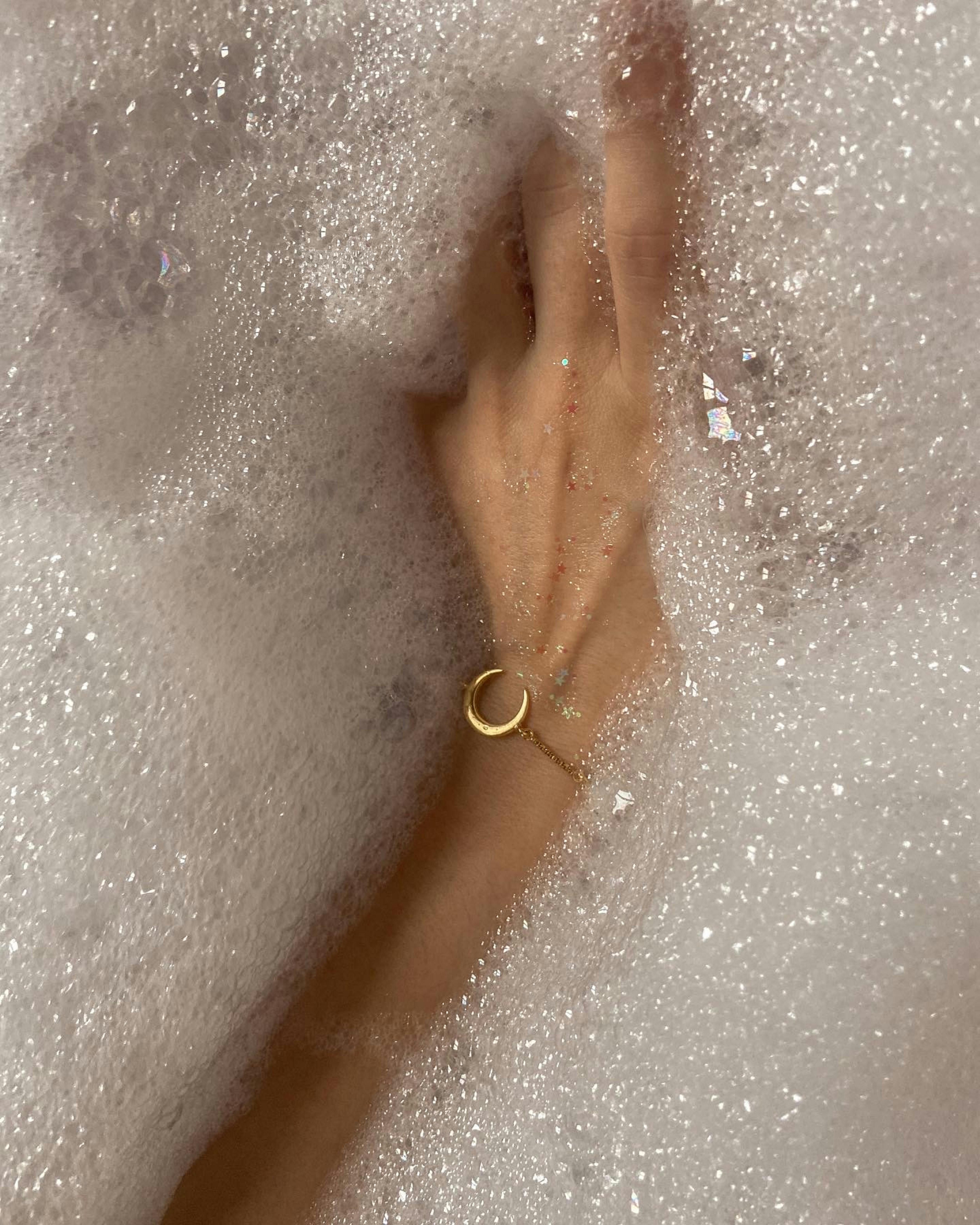 woman's hand in bath