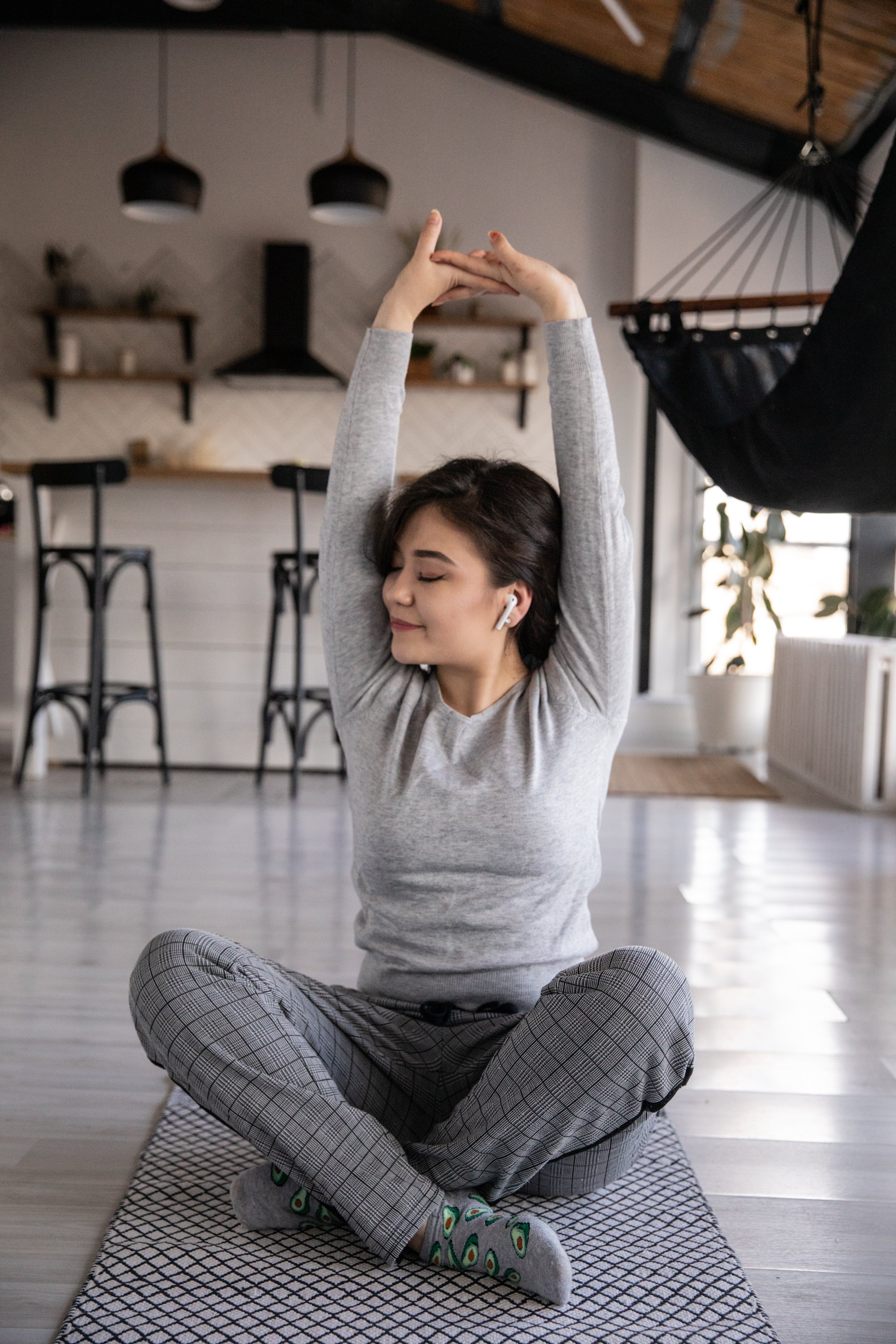 woman stretching on yoga mat